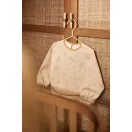 Jollein Woolly hosszú ujjú etetőkabát zsebbel kiterítve
