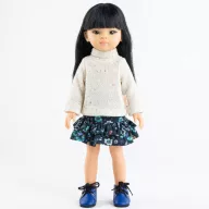 Paola Reina Liu 32 cm-es játékbaba kötött pulóverben és kék virágos szoknyában áll
